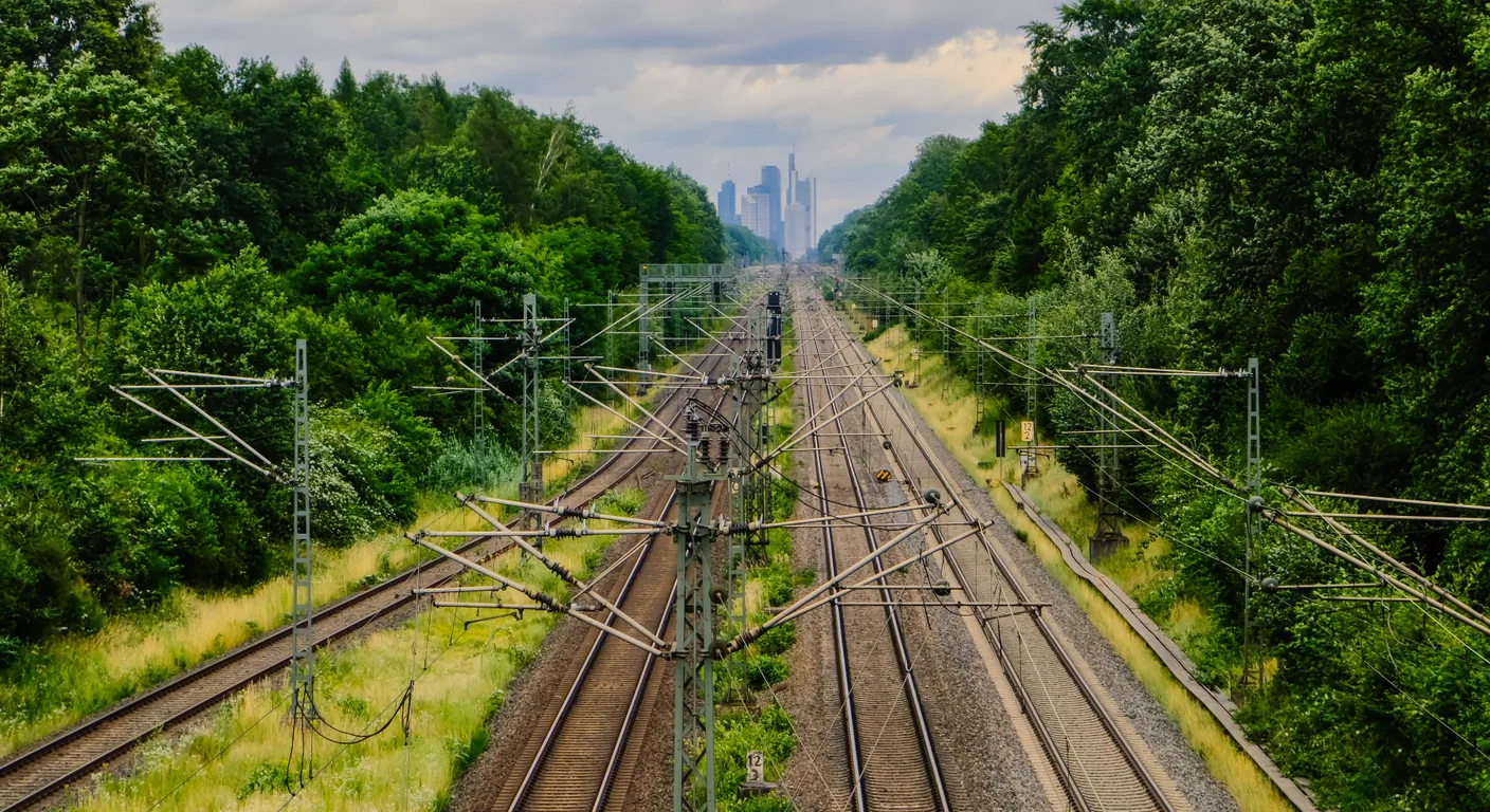 Rail lines and overhead wires suggesting documentation infrastructure, knowledge routes, and AI-ready documentation